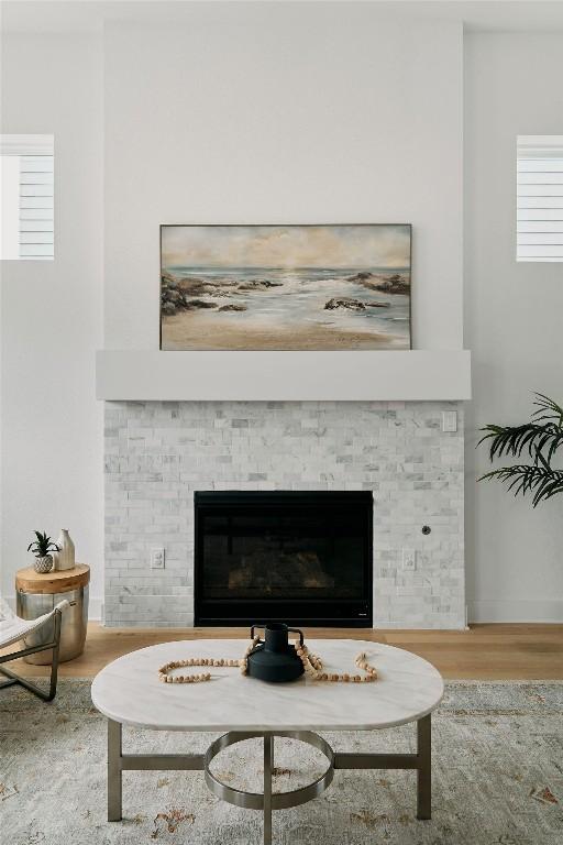 6116 Toscana Ave, Austin, TX 78724 - detailed view of wood finished floors, a glass covered fireplace, and baseboards
