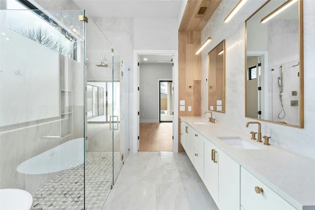 1719 Piedmont Ave, Austin, TX 78757 - full bathroom with a shower stall and double vanity