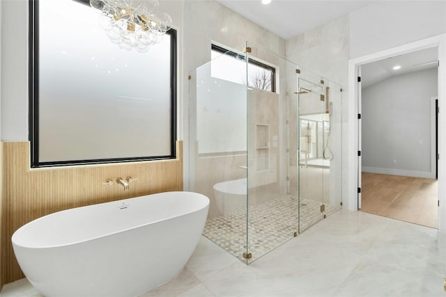 1719 Piedmont Ave, Austin, TX 78757 - bathroom with a soaking tub, a shower stall, a chandelier, and recessed lighting