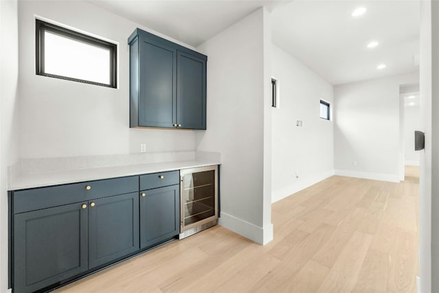 1719 Piedmont Ave, Austin, TX 78757 - indoor dry bar with wine cooler, light wood-style floors, baseboards, and recessed lighting