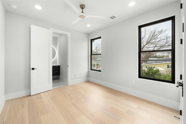 1719 Piedmont Ave, Austin, TX 78757 - unfurnished bedroom with light wood-style flooring, recessed lighting, a ceiling fan, and ensuite bath