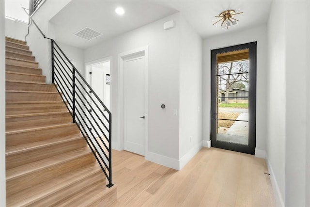 1719 Piedmont Ave, Austin, TX 78757 - entrance foyer with light wood-type flooring and stairway