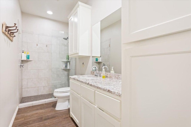 113 Lcr 913, Jewett, TX 75846 - bathroom with vanity, a walk in shower, wood finished floors, and recessed lighting