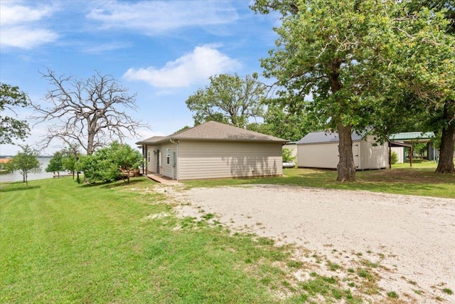 113 Lcr 913, Jewett, TX 75846 - view of side of home with a yard and an outbuilding
