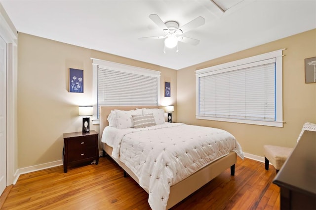 5614 Shoalwood Ave, Austin, TX 78756 - bedroom featuring baseboards, light wood-style flooring, and a ceiling fan