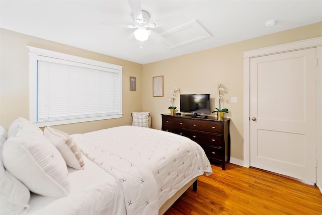 5614 Shoalwood Ave, Austin, TX 78756 - bedroom with attic access, light wood-style floors, ceiling fan, and baseboards