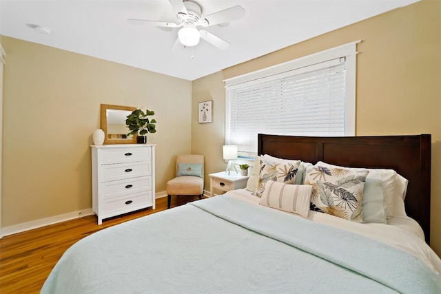 5614 Shoalwood Ave, Austin, TX 78756 - bedroom with wood finished floors, baseboards, and a ceiling fan