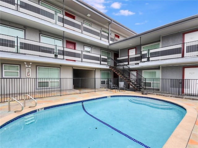 3110 Red River St Unit C-402, Austin, TX 78705 - community pool featuring fence and stairway