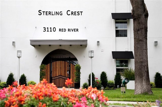 3110 Red River St Unit C-402, Austin, TX 78705 - doorway to property featuring stucco siding