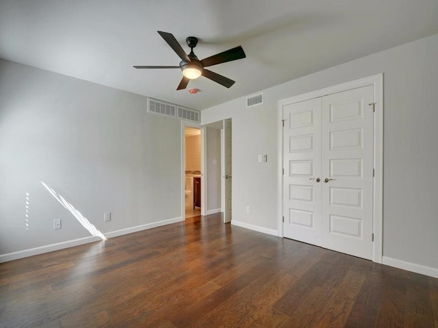 3110 Red River St Unit C-402, Austin, TX 78705 - unfurnished bedroom with a closet, wood finished floors, baseboards, and ceiling fan