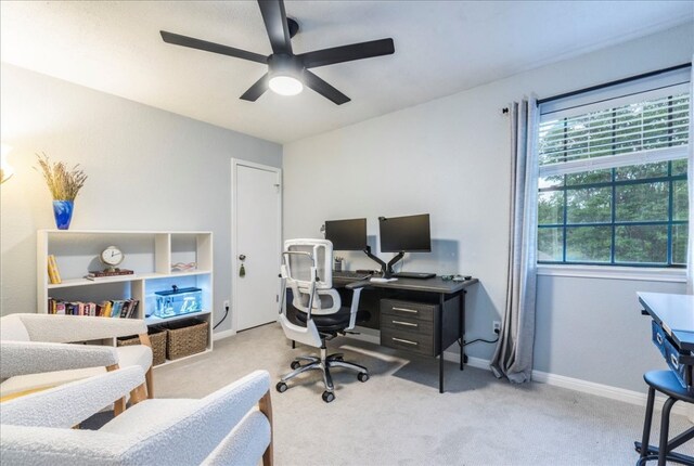 home office featuring ceiling fan, carpet floors, and baseboards