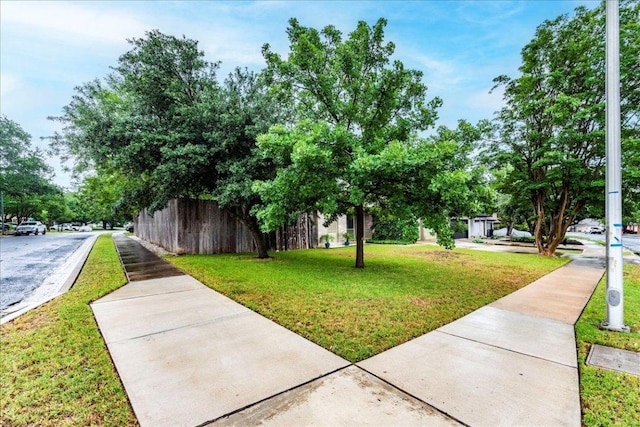 surrounding community with a yard