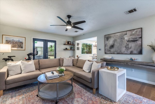 12005 Thompkins Dr, Austin, TX 78753 - living area with a ceiling fan, wood finished floors, and french doors