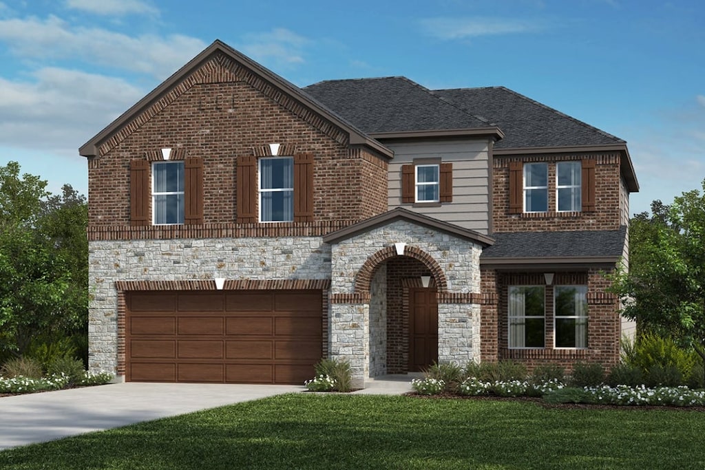 3747 Liberi Ln, Round Rock, TX 78665 - traditional-style house featuring a front lawn, concrete driveway, stone siding, a garage, and brick siding