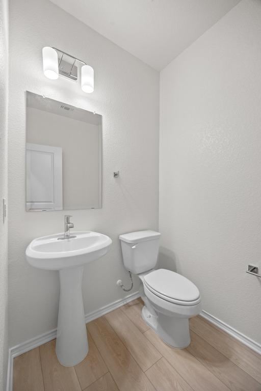 3747 Liberi Ln, Round Rock, TX 78665 - half bathroom with wood finished floors