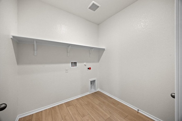 3747 Liberi Ln, Round Rock, TX 78665 - laundry area with gas dryer hookup, light wood finished floors, and washer hookup