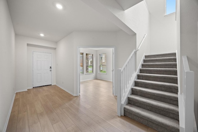 3747 Liberi Ln, Round Rock, TX 78665 - foyer entrance with stairway, light wood finished floors, and recessed lighting