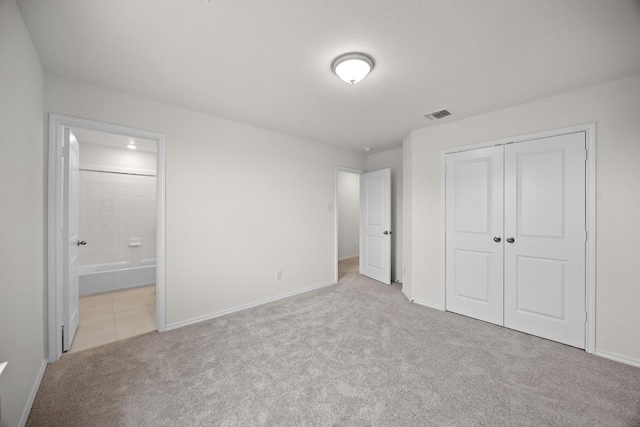 3747 Liberi Ln, Round Rock, TX 78665 - unfurnished bedroom featuring carpet flooring, a closet, and ensuite bathroom
