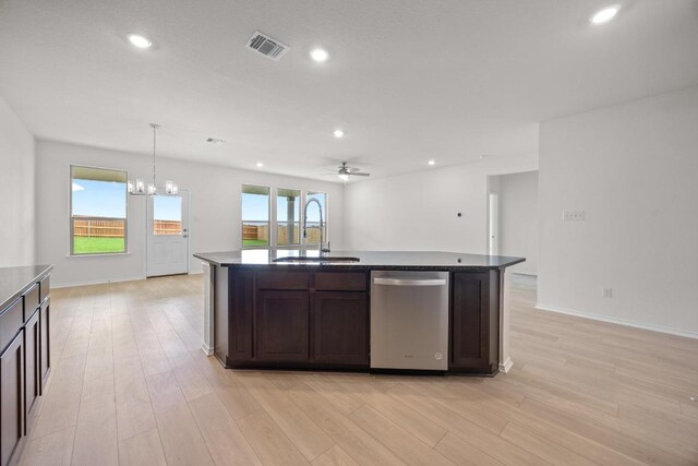 3747 Liberi Ln, Round Rock, TX 78665 - kitchen with stainless steel dishwasher, dark brown cabinetry, a chandelier, ceiling fan, and light wood-style floors