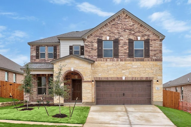 3747 Liberi Ln, Round Rock, TX 78665 - view of front of house featuring concrete driveway, a garage, brick siding, and stone siding
