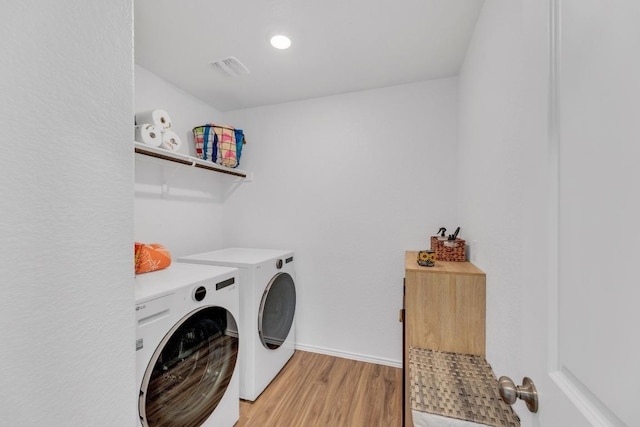 3201 Dusted Daisey St, Pflugerville, TX 78660 - laundry area with washing machine and dryer, light wood-style flooring, and baseboards