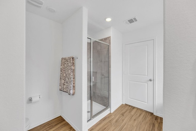 3201 Dusted Daisey St, Pflugerville, TX 78660 - full bathroom featuring wood finished floors, a shower stall, and baseboards