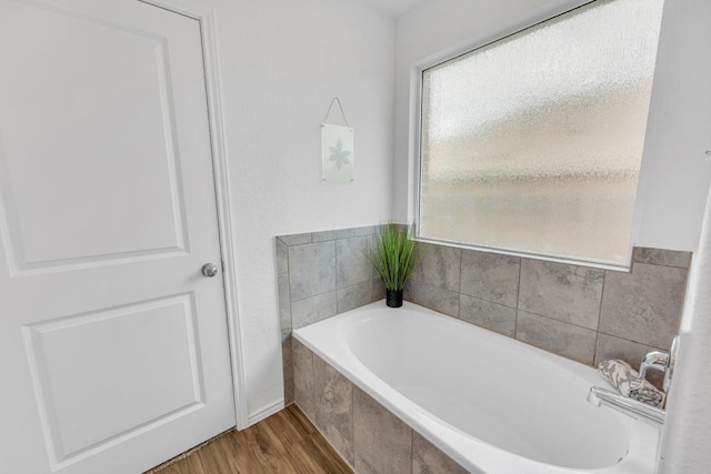 3201 Dusted Daisey St, Pflugerville, TX 78660 - full bath featuring a garden tub and wood finished floors