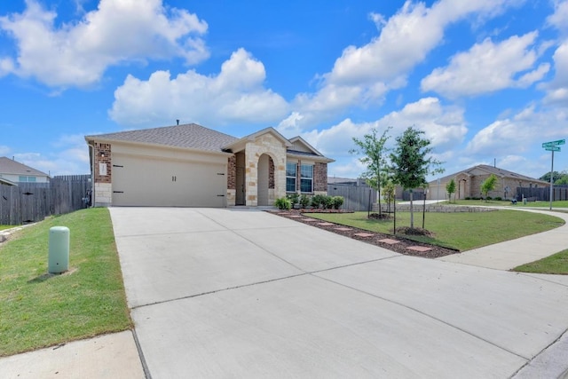 3201 Dusted Daisey St, Pflugerville, TX 78660 - ranch-style home with concrete driveway, brick siding, an attached garage, and stone siding