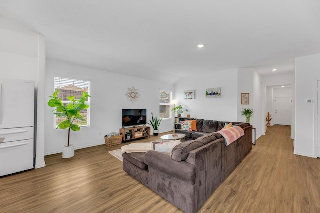 3201 Dusted Daisey St, Pflugerville, TX 78660 - living room with light wood-type flooring, plenty of natural light, recessed lighting, and baseboards