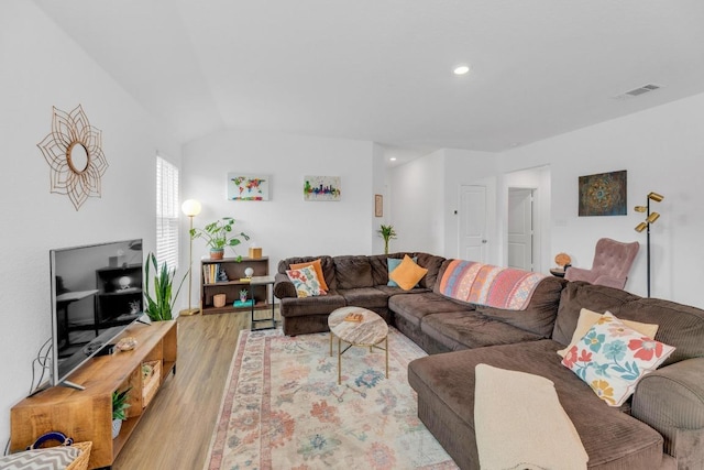 3201 Dusted Daisey St, Pflugerville, TX 78660 - living area featuring wood finished floors, vaulted ceiling, and recessed lighting