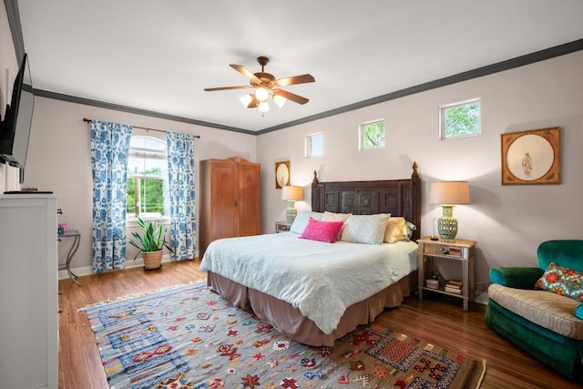1907 Winsted Ln Unit 1, Austin, TX 78703 - bedroom featuring crown molding, wood finished floors, multiple windows, baseboards, and ceiling fan