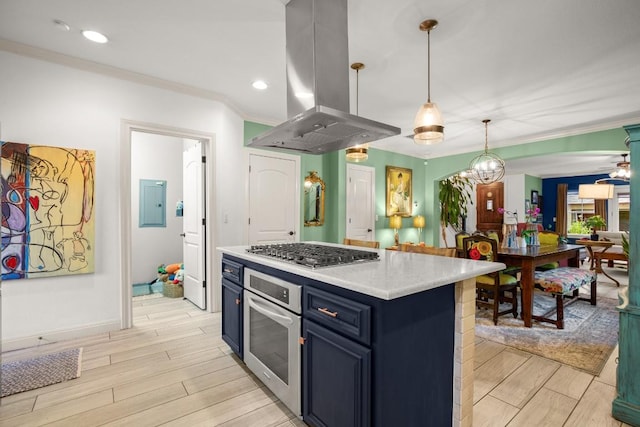 1907 Winsted Ln Unit 1, Austin, TX 78703 - kitchen featuring island range hood, stainless steel appliances, blue cabinetry, light countertops, and light wood-style flooring