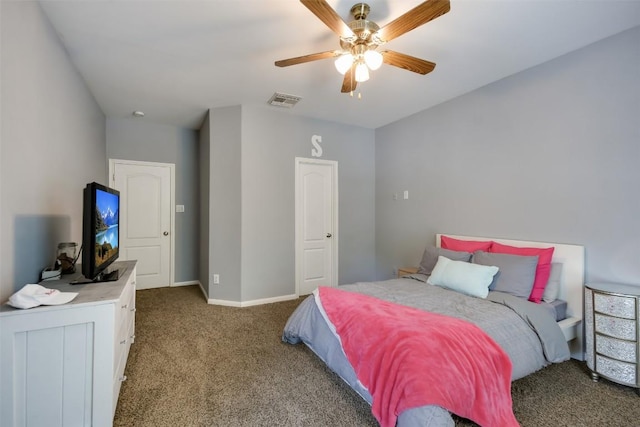 carpeted bedroom with ceiling fan and baseboards