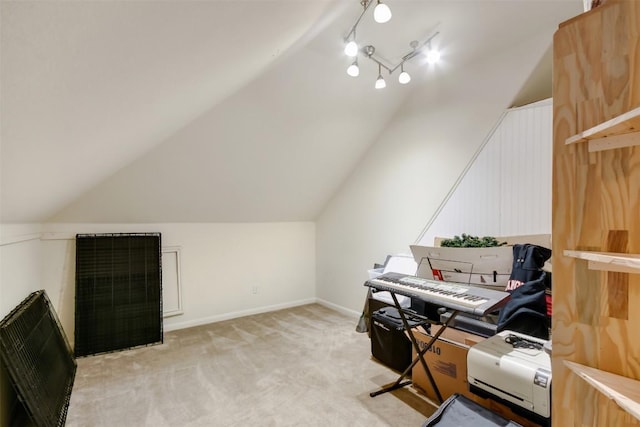 office space featuring light carpet and lofted ceiling