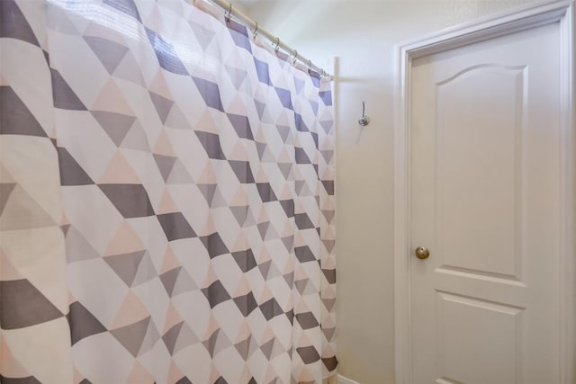 bathroom with a shower with curtain