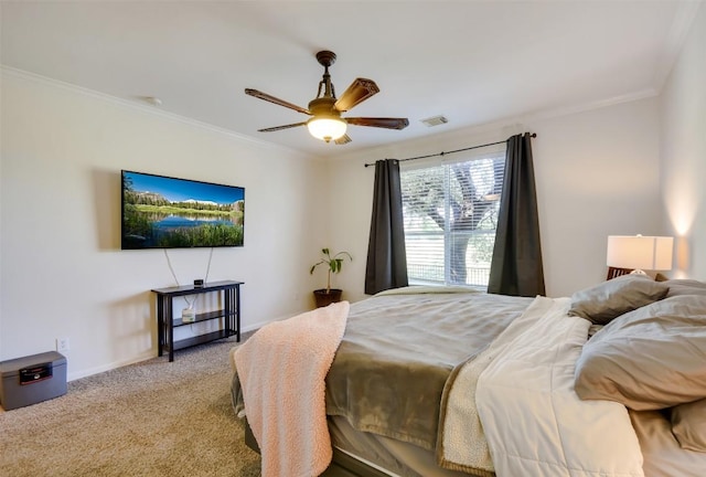 carpeted bedroom featuring ornamental molding, a ceiling fan, and baseboards