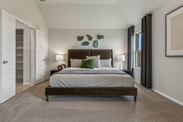 208 Hidalgo Ln, Elgin, TX 78621 - bedroom featuring lofted ceiling, carpet flooring, and baseboards