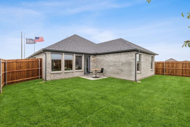 208 Hidalgo Ln, Elgin, TX 78621 - rear view of house with roof with shingles, brick siding, and a patio area