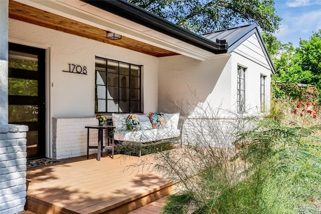 property entrance with stucco siding