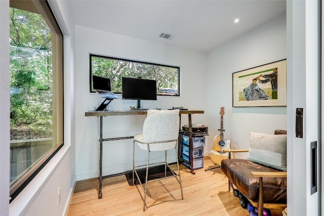 home office featuring wood finished floors, recessed lighting, and baseboards
