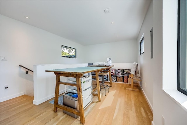 dining area featuring light wood finished floors, baseboards, and recessed lighting