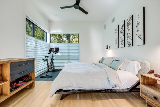 bedroom featuring light wood finished floors and ceiling fan
