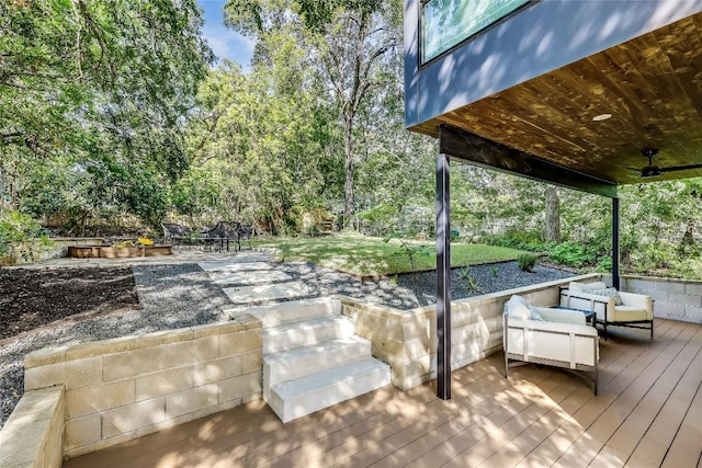 wooden deck with a lawn