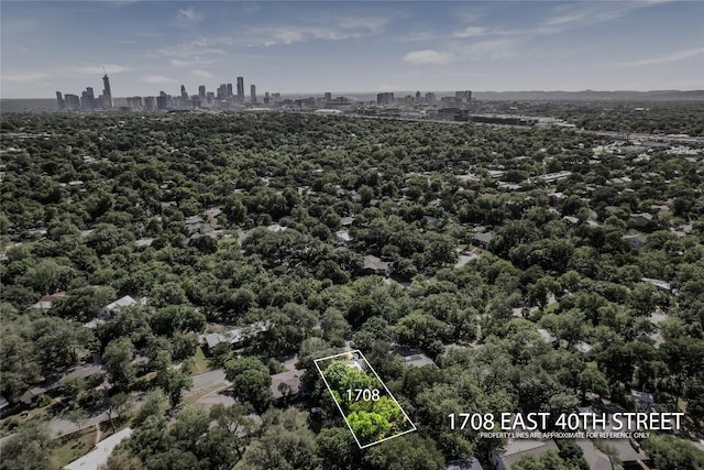 aerial view of property's location featuring a skyline view and property parcel outlined