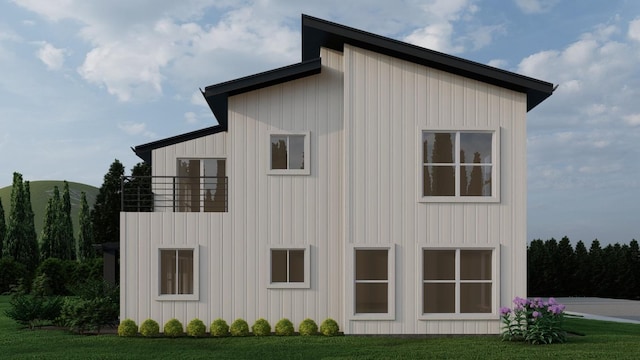 21302 Park Cir, Leander, TX 78645 - view of property exterior featuring a balcony, board and batten siding, and a lawn