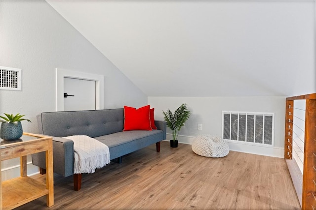 146 Caldwell Ranch Rd, Cedar Creek, TX 78612 - living area with vaulted ceiling, wood finished floors, and baseboards