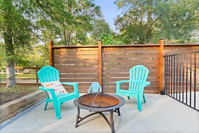 146 Caldwell Ranch Rd, Cedar Creek, TX 78612 - view of patio featuring a fire pit