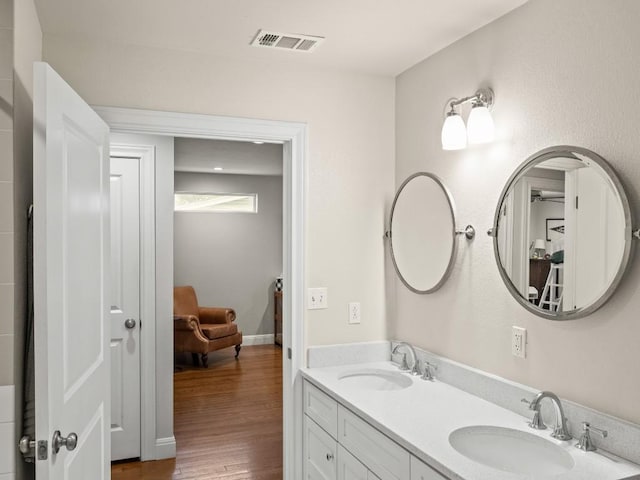 3803 Manorwood Rd, Austin, TX 78723 - bathroom with wood finished floors and double vanity