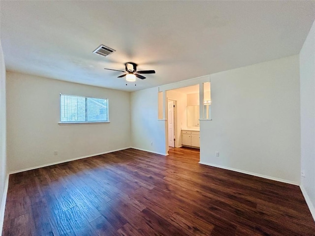 1906 Surrey Dr, Round Rock, TX 78664 - unfurnished room with dark wood-type flooring, a ceiling fan, and baseboards