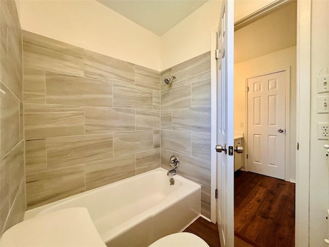 1906 Surrey Dr, Round Rock, TX 78664 - bathroom with wood finished floors, shower / washtub combination, and toilet